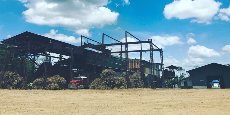 A sugar mill on the family farm, under a bright Costa Rican sky