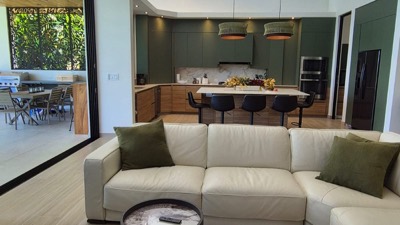 The living room, open to the kitchen