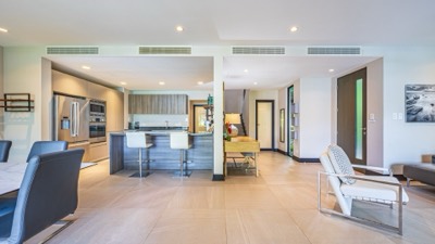 The kitchen and the living room beyond it
