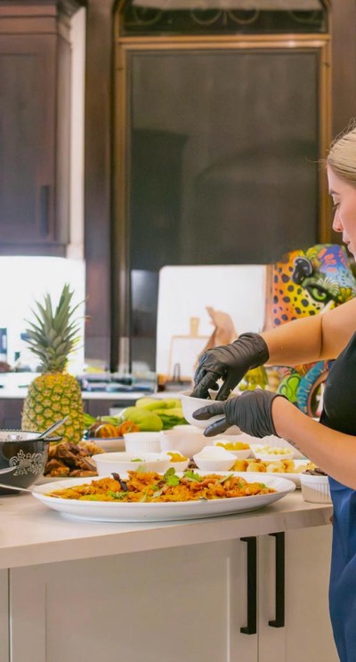 A private chef cooking in the villa kitchen