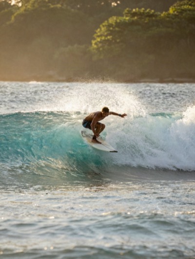Surfing the break at Dominical